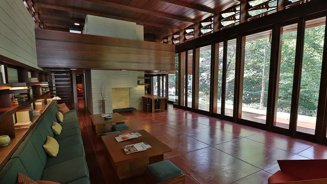 Interior living area of Bachman-Wilson House with built-in furniture and wooden finish.