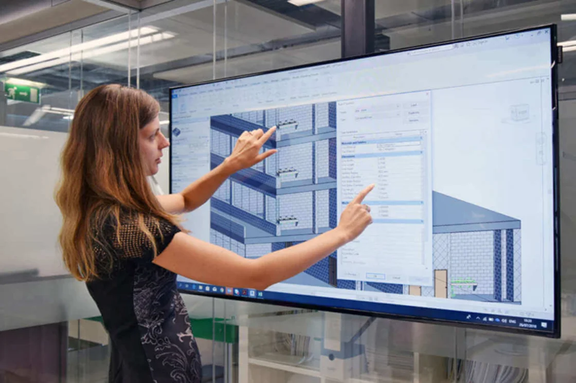 BIM manager working on coordinated 3D model of building systems.