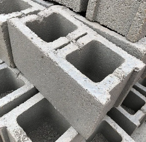 U-shaped concrete lintel block installed above a window opening.