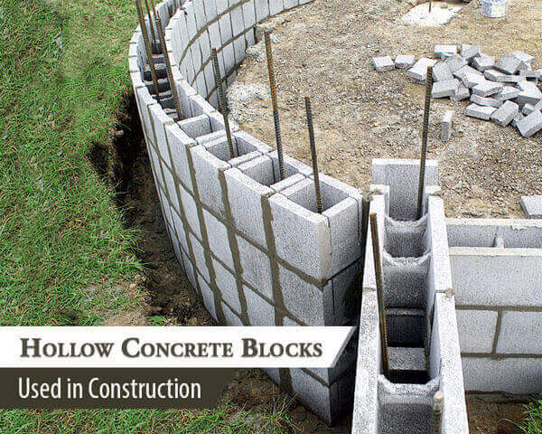 Hollow concrete blocks showing internal cores ready for reinforcement.