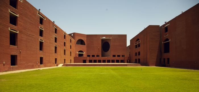 The Indian Institute of Management Ahmedabad Campus makes use of brick cladding and shaded courtyards to adapt to local climatic conditions.
