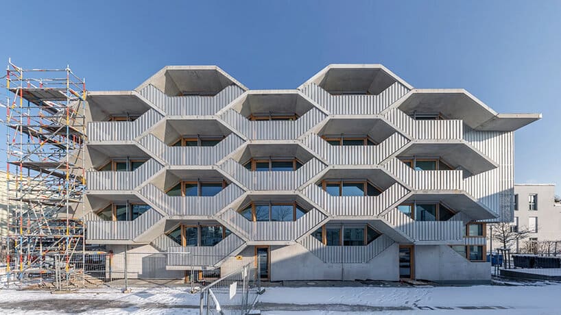 Honeycomb-inspired architectural facade using hexagonal modules.