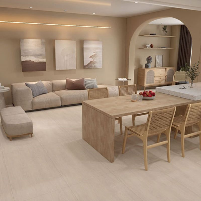 Residential interior showing warm material palette with wood finishes, neutral tiles, and soft textures.