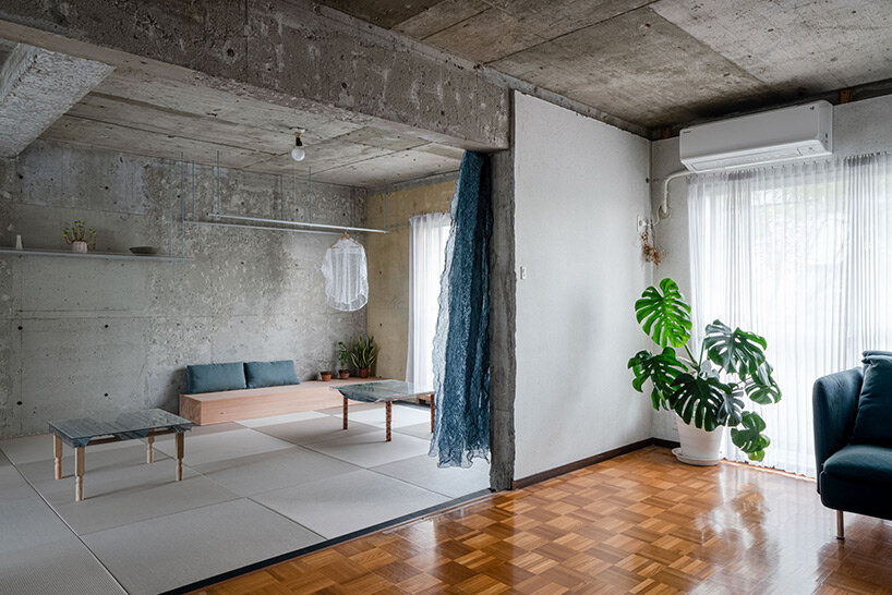 Modern building with smooth exposed concrete walls and refined detailing.