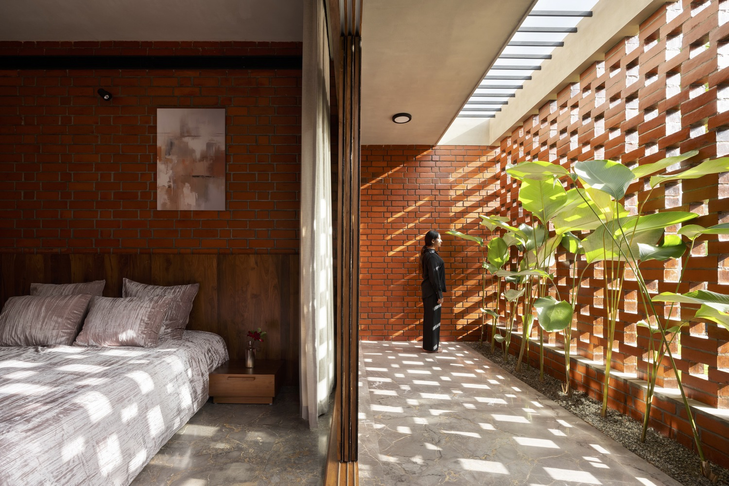 Terracotta façade system providing shading and natural ventilation.*
