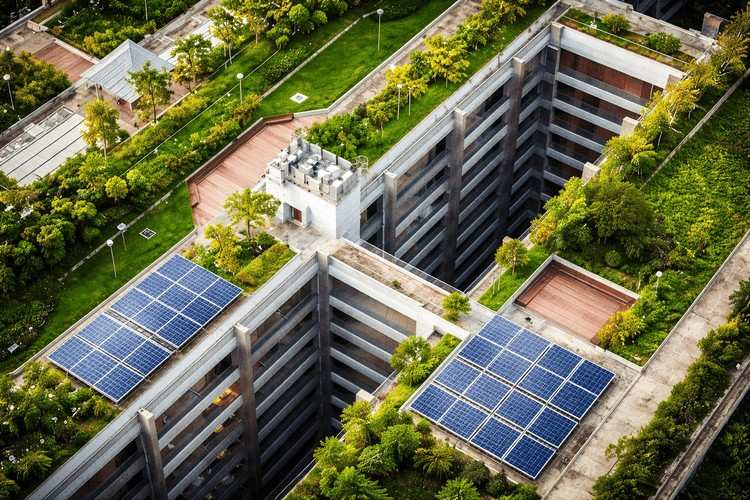 &nbsp;Aerial view of a sustainable commercial building with rooftop gardens and solar panels installed on the structure.&nbsp;&nbsp;