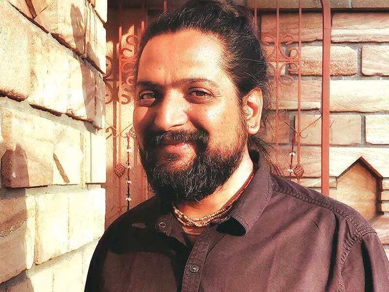Architect Himanshu Patel known for vernacular architecture using local materials and climate-responsive sustainable design.