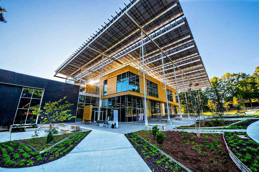 At Georgia Tech University Students interact with its solar panels, water recycling systems, and composting mechanisms learning sustainable practices through hands-on experience.