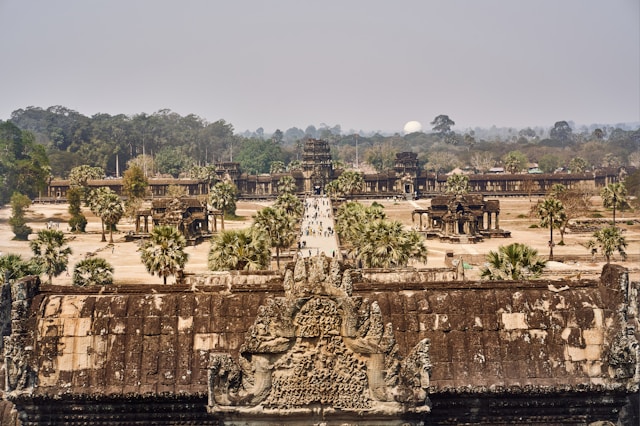 Aerial view of Angkor Wat, a global heritage site, showcasing its intricate carvings and expansive courtyards. 