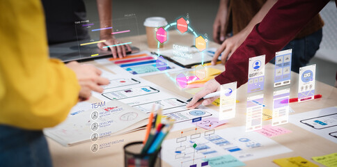 A group of people working on a UI-UX design project.