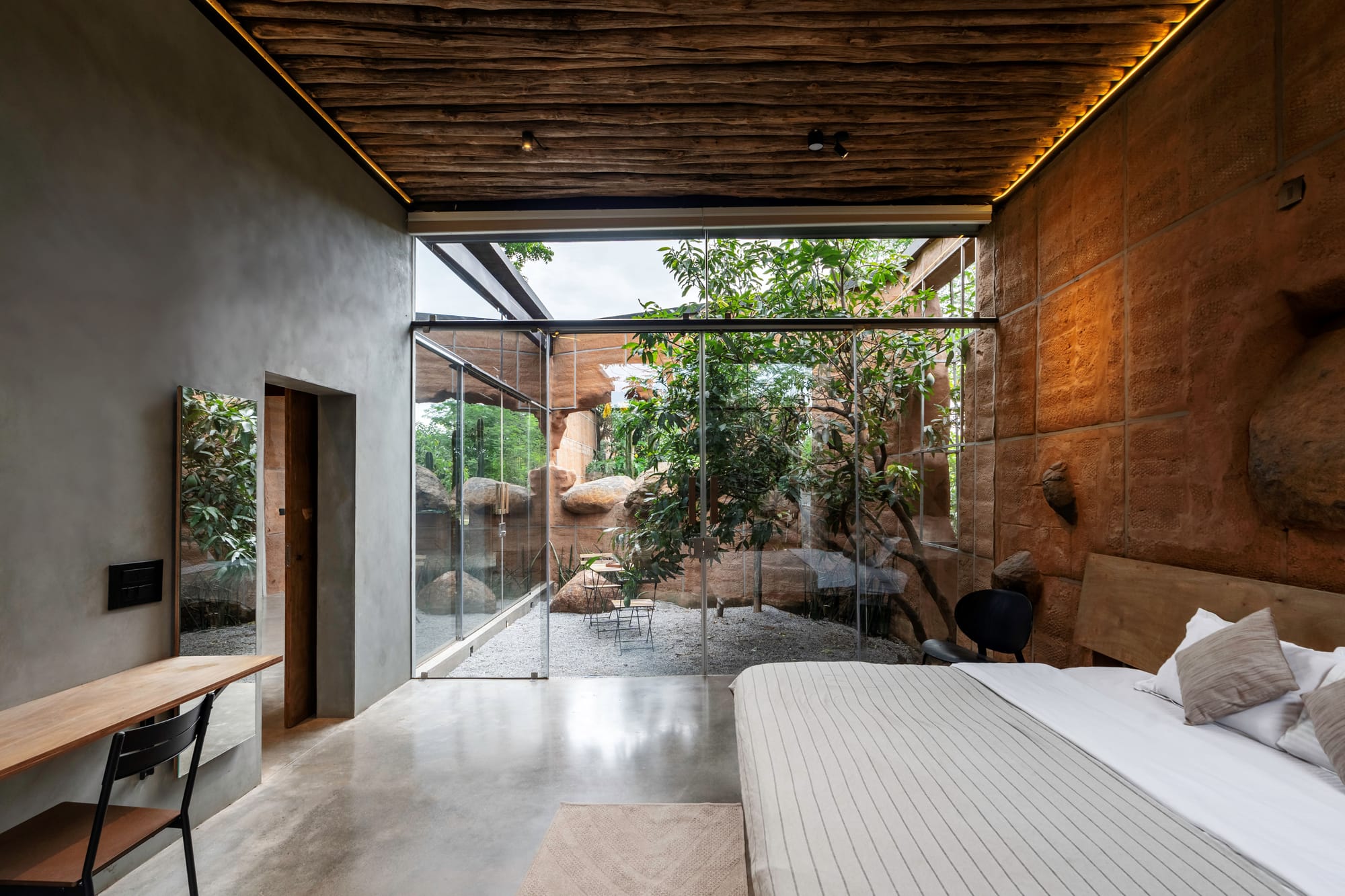 Compressed Earth Blocks wall Bedroom with a rustic and open to Nature theme