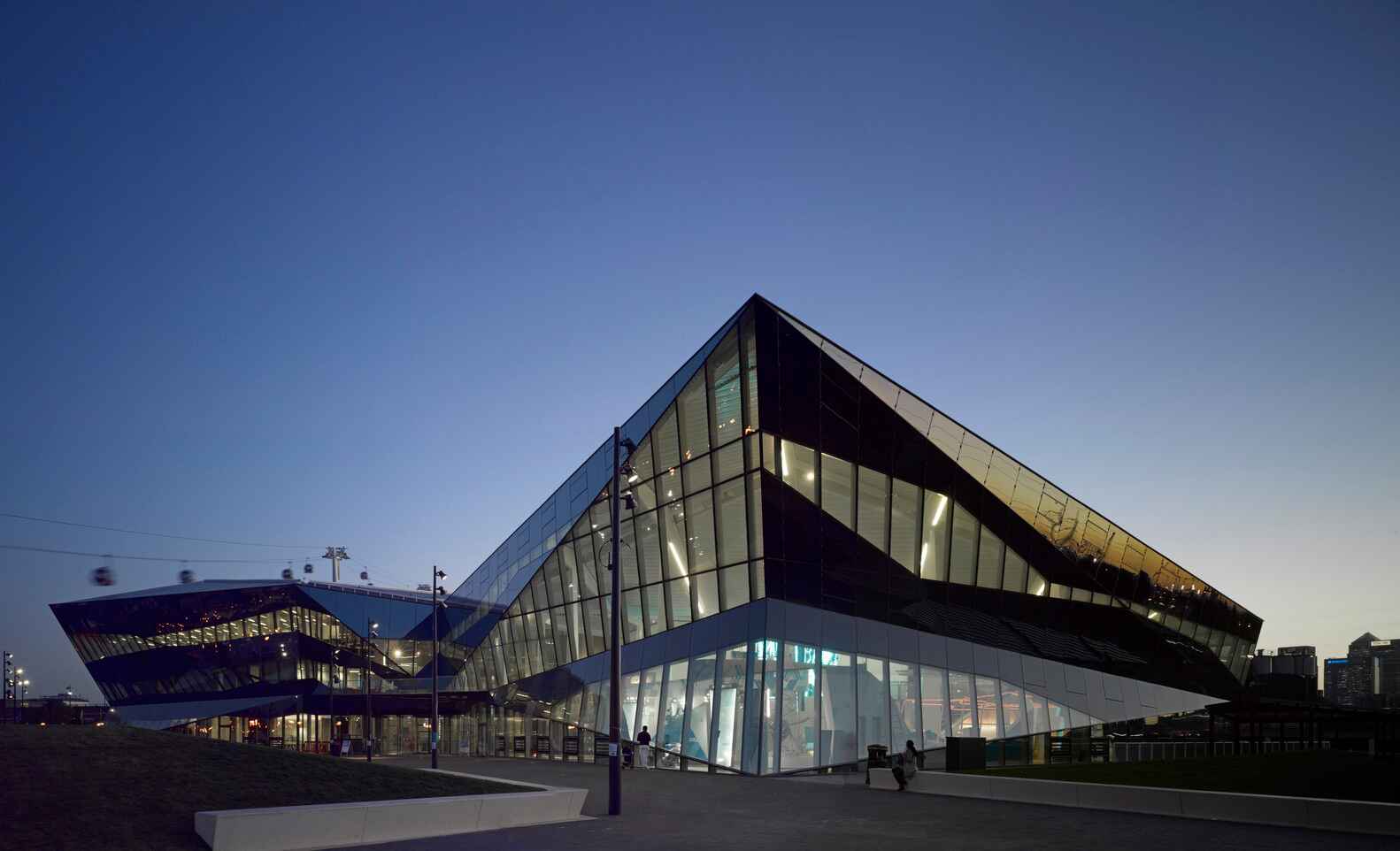 A sustainable design-infused building with glass walls and sharp lines.