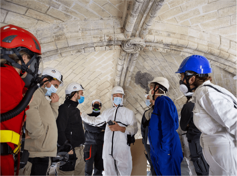Project Manager in Notre Dame Paris guiding his team