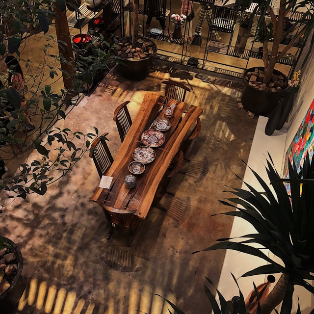 A view of a Vastu-compliant house showcasing a dining area in the courtyard.