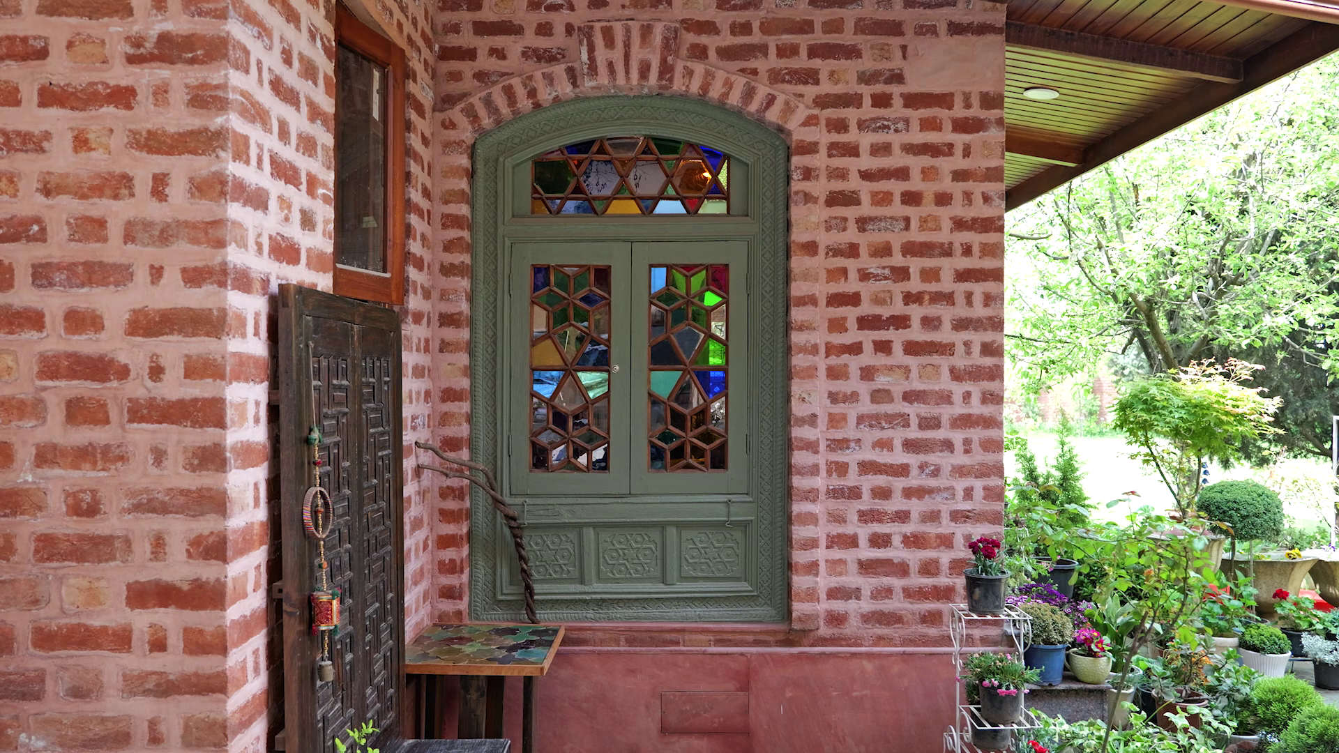 Colored Tinted Glass Complemented by the raw brick facade
